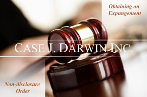 Gavel on table with overlay text reading "Obtaining an Expungement, Non-disclosure order, Case J. Darwin, INC."